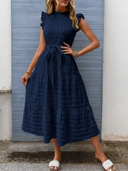 FashionFlow - Elegant Midikjole med Rufsete Ermer og Knytinger Motelys